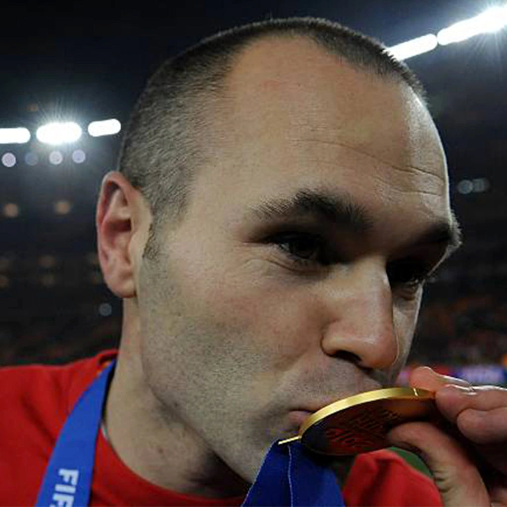 Shiny gold World Cup medal representing football championship victory