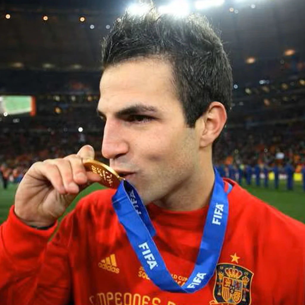 Golden World Cup medal celebrating international football success