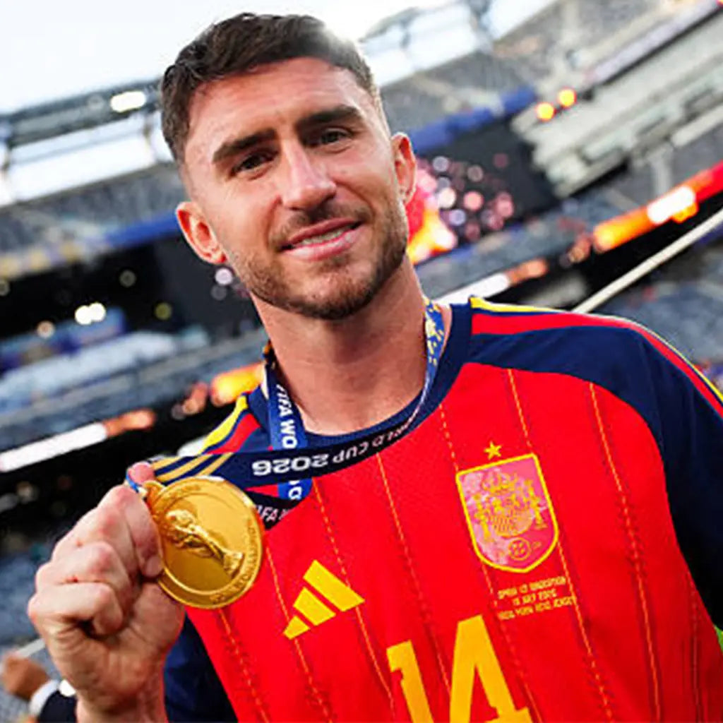 Spain captain wearing World Cup 2026 gold medal on podium