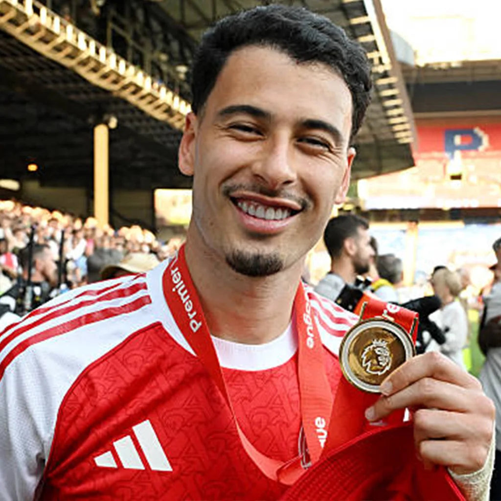Fans purchasing themed medals after a football tournament