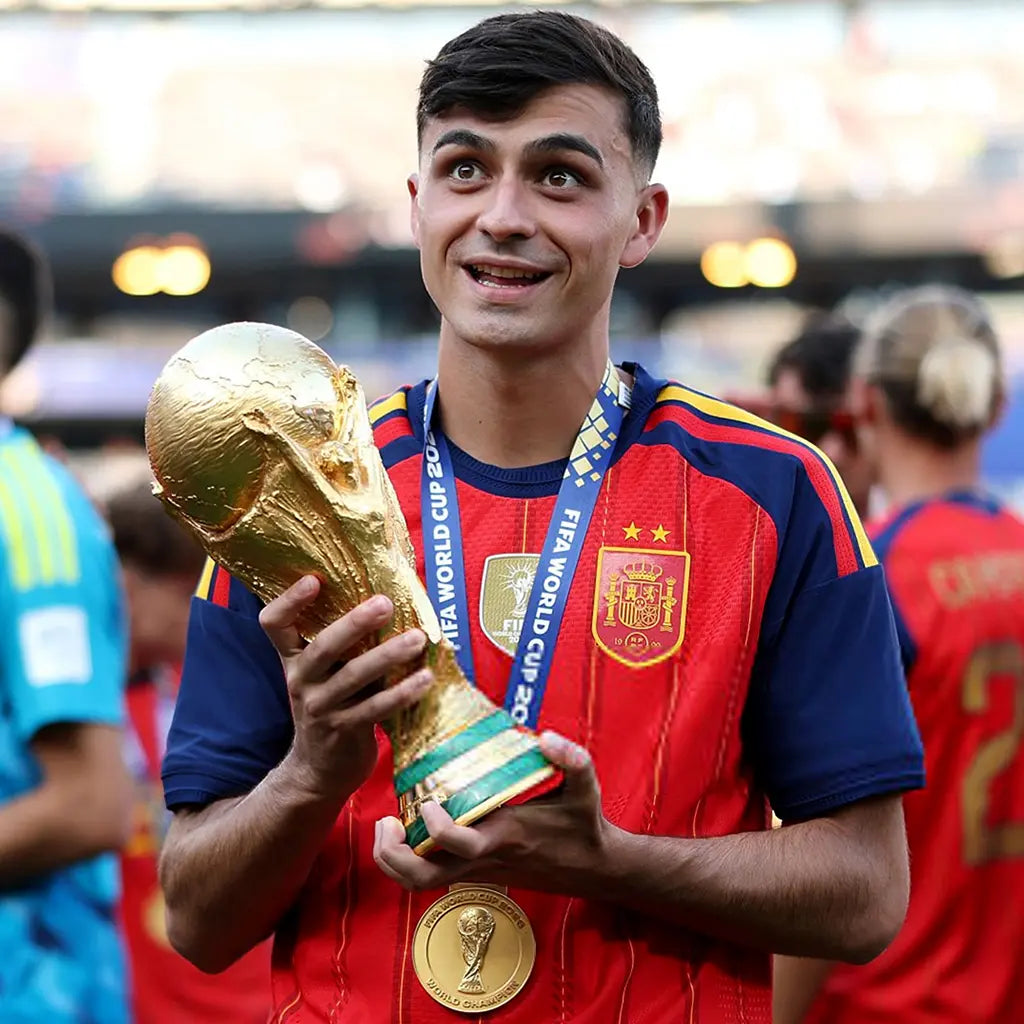World Cup 2026 gold medal hanging around champion's neck