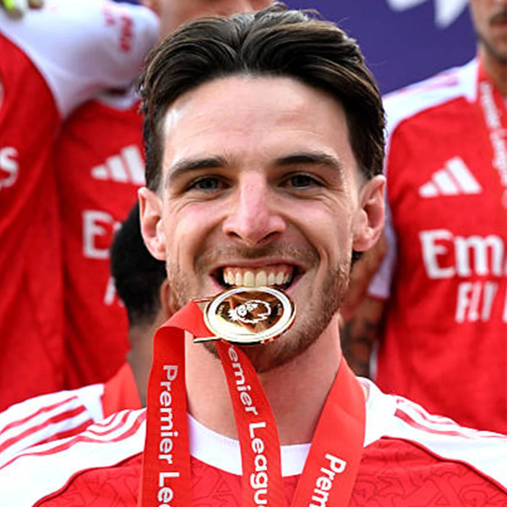 Supporters buying medals to commemorate football success