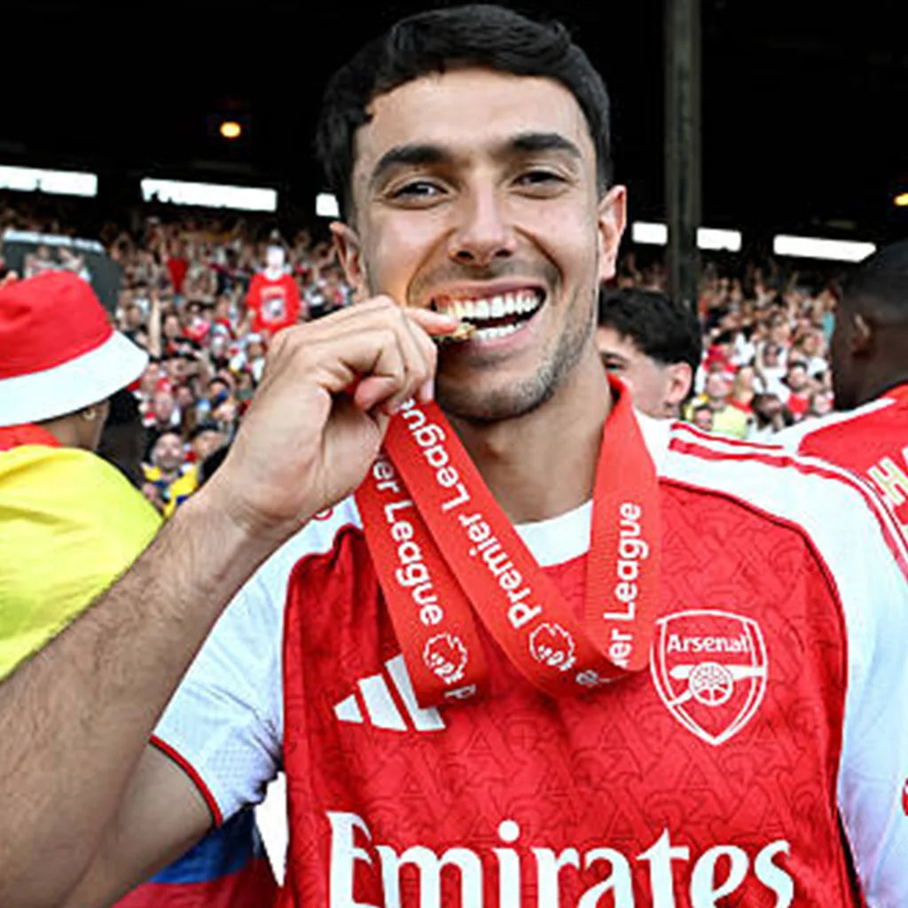 Fans celebrating football victory by purchasing commemorative medals online