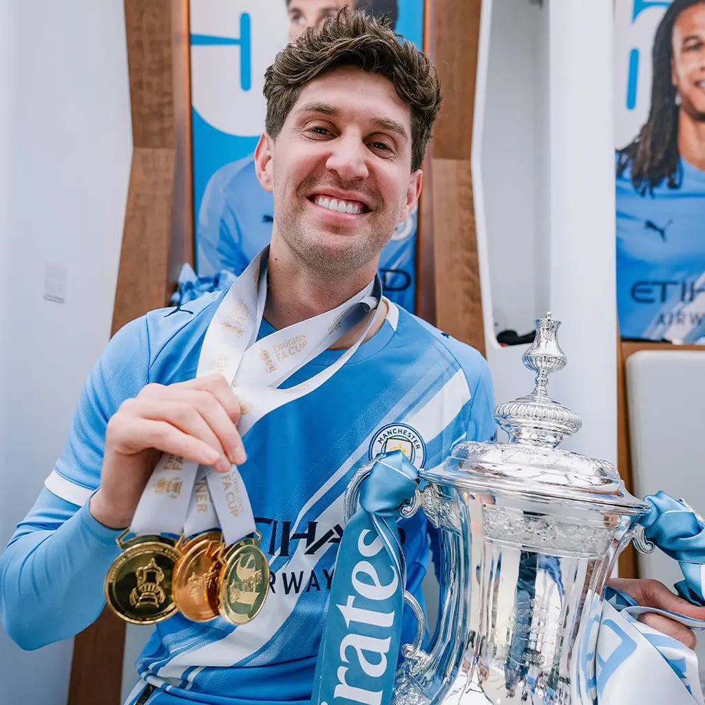 Fans viewing engraved football medals on an online store page